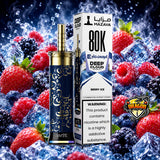 A vape pen and its retail box from Deep Cloud x Mazaya, Berry Ice flavor, set against a dynamic background of ice cubes, water splashes, and fresh berries. The vape pen has a dark blue body with gold Arabic calligraphy and a gold mouthpiece.