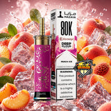 A Deep Cloud Mazaya Hookah 80K E-Cigarette in the Peach Ice flavor, shown with its retail packaging box. The device features a metallic gold mouthpiece and a vibrant magenta-purple body with gold Arabic calligraphy.